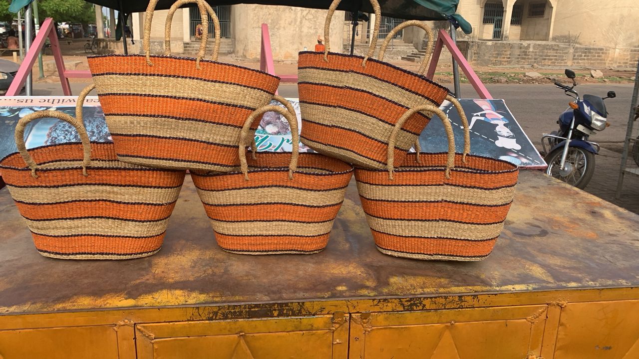 Baskets piled up on work surface in colourful orange and neattral