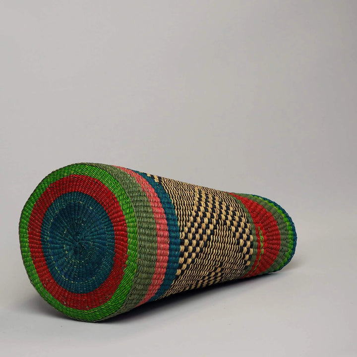 Base of Shopper Basket in shades of green and red with black leather handles and tan trim