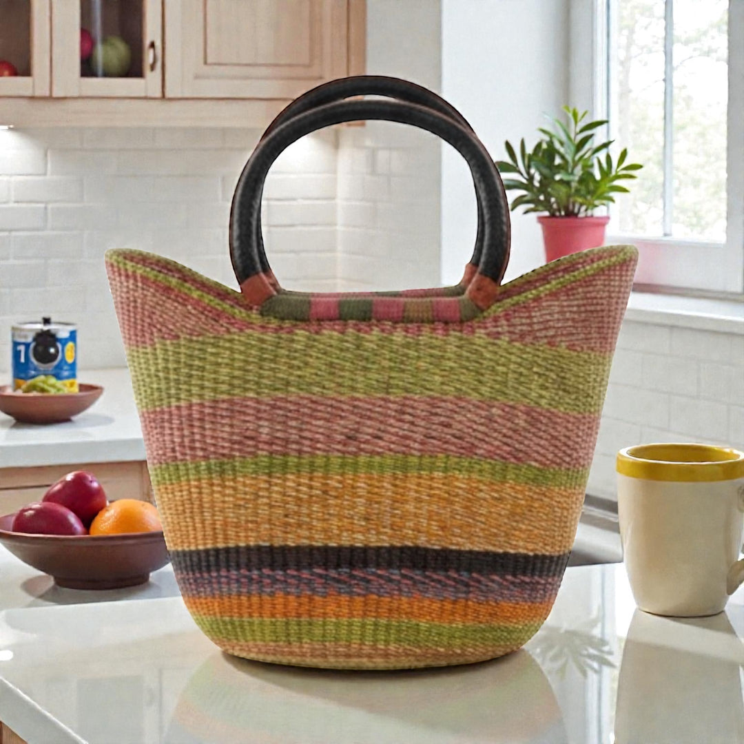 Multicolored woven basket on a kitchen counter with a window and plant in the background