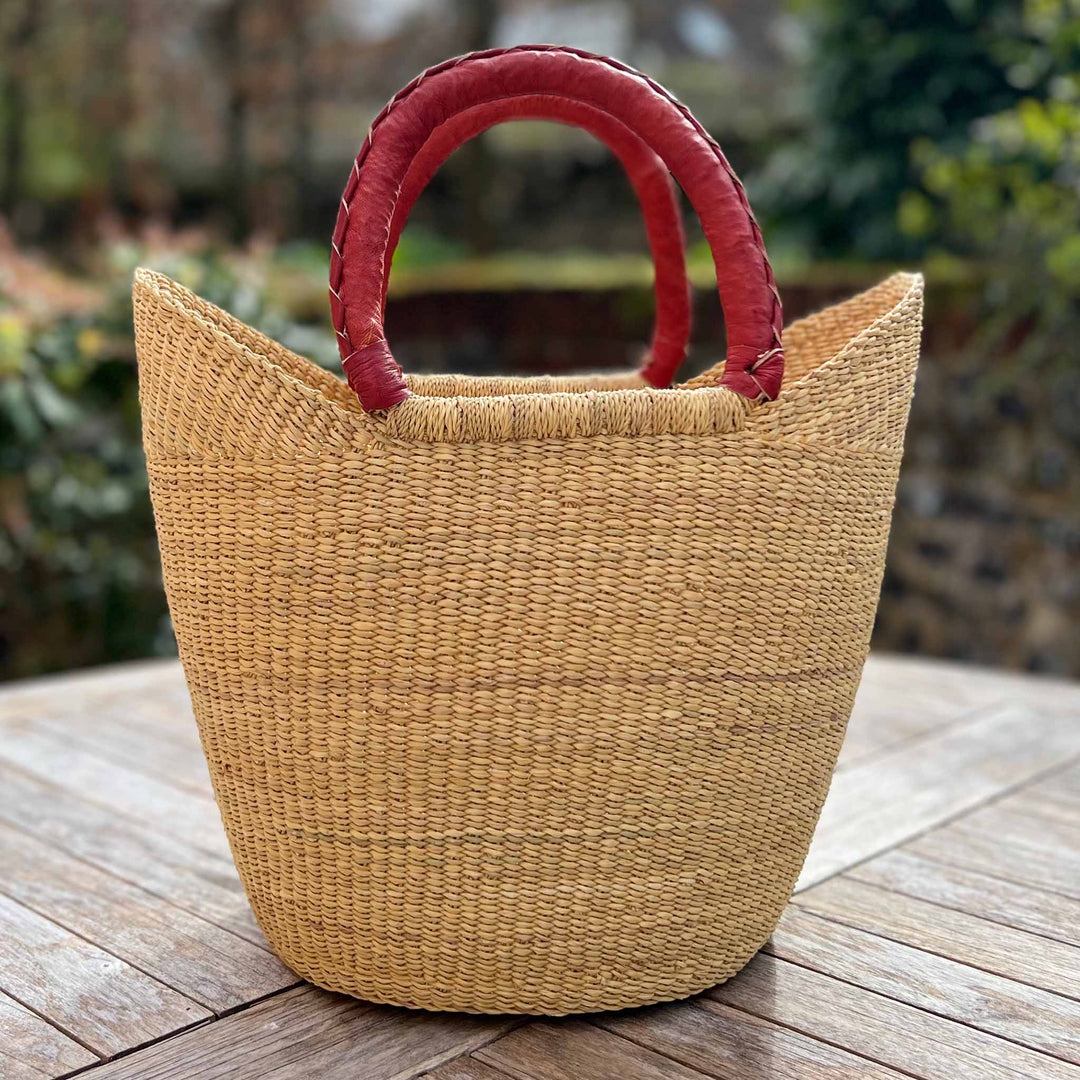 Plain Shopper Basket with Tan Leather Handles in Garden Setting