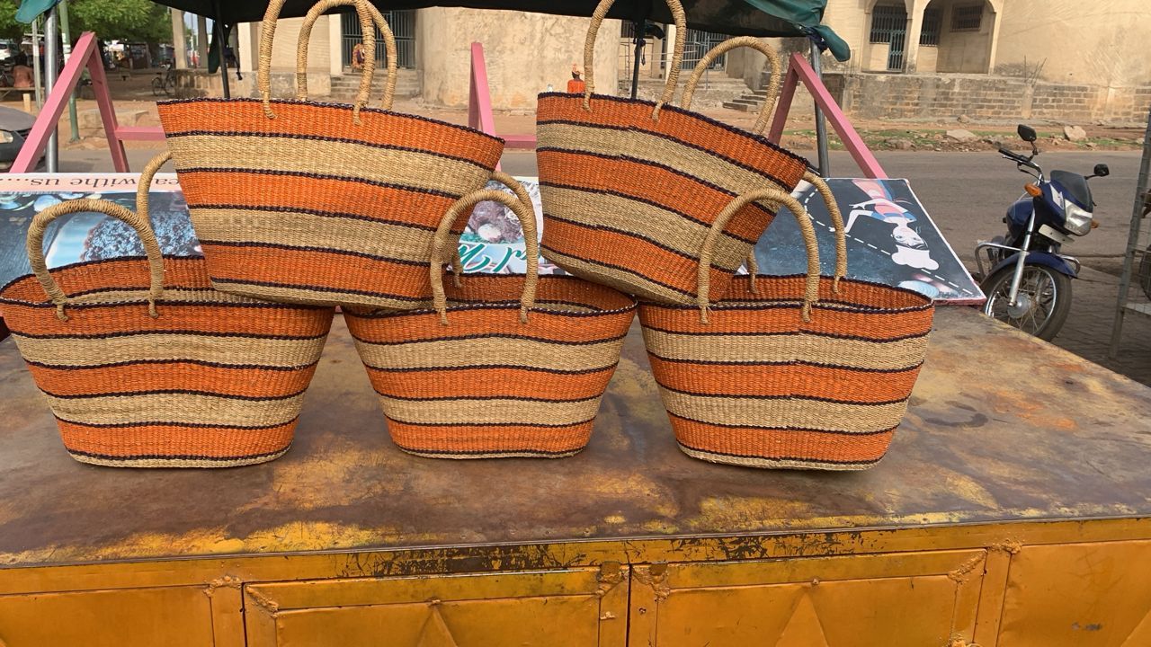 Baskets piled up on work surface in colourful orange and neattral