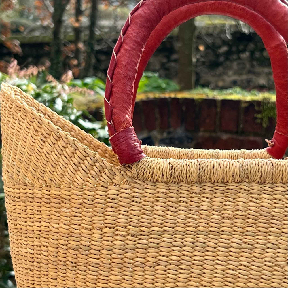 Close Up of Leather Handles and Neutral Grass Basket