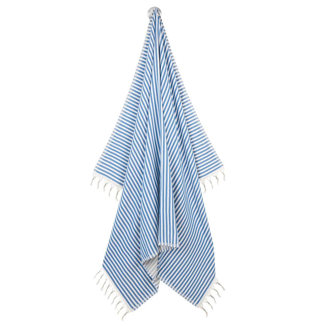Blue and white striped beach and travel blanket, shown hanging down.