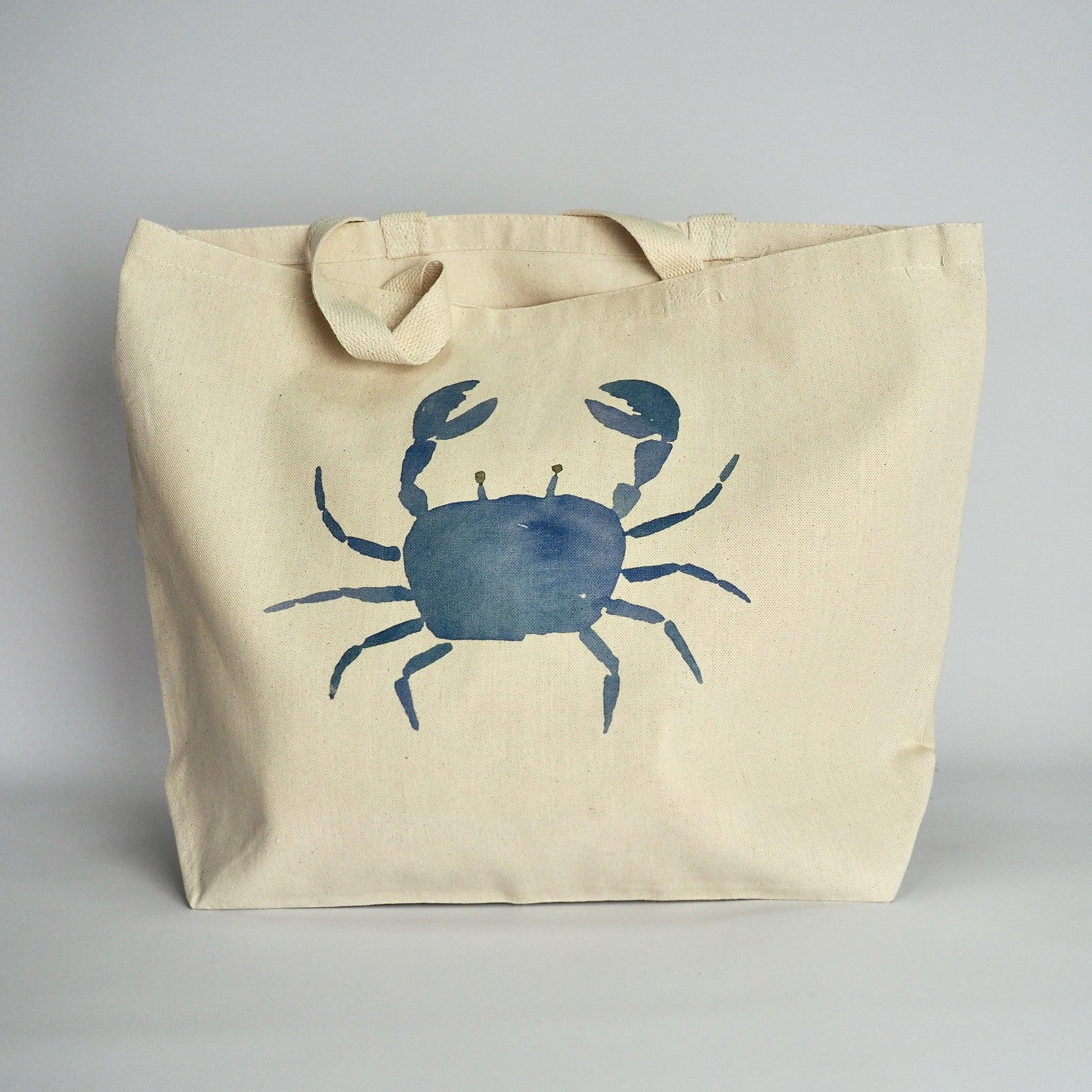 XL Canvas Tote Bag with a fun crab print design on front in blue and with handles folded over.
