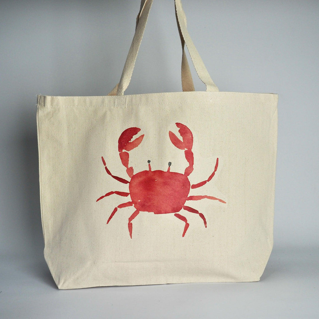 XL Canvas Tote Bag with a fun crab print design on front in coral and set against a plain background.  