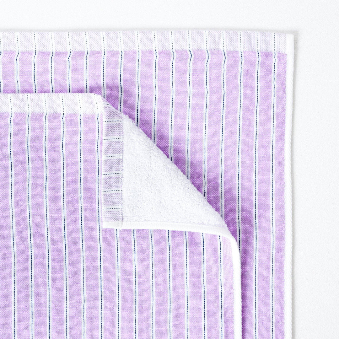 Baby Bath or small Beach Towel in lilac with stripe.  The towel is folded down to show the reverse soft terry pile.  