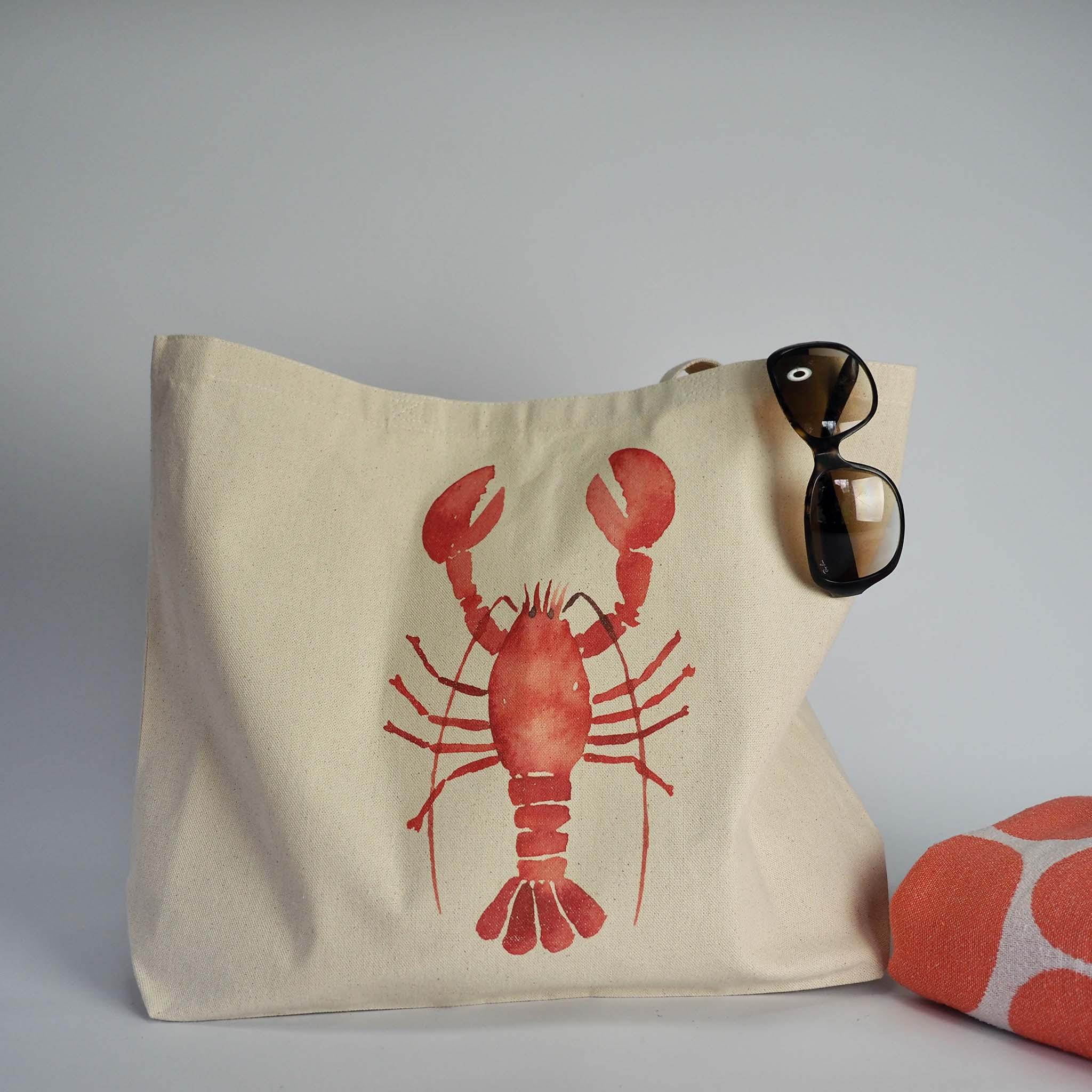 Beach ready with our XL Canvas tote bag and lobster design on the front, with sunglasses and coral spotty beach towel.